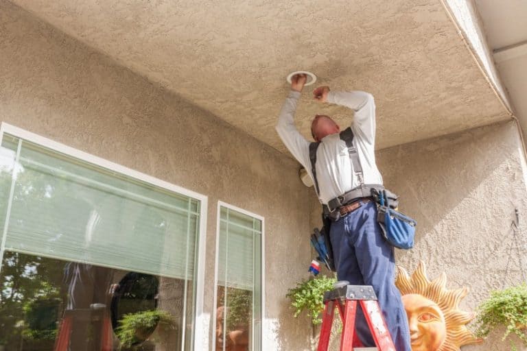 Electrician working on recessed lighting in Maui