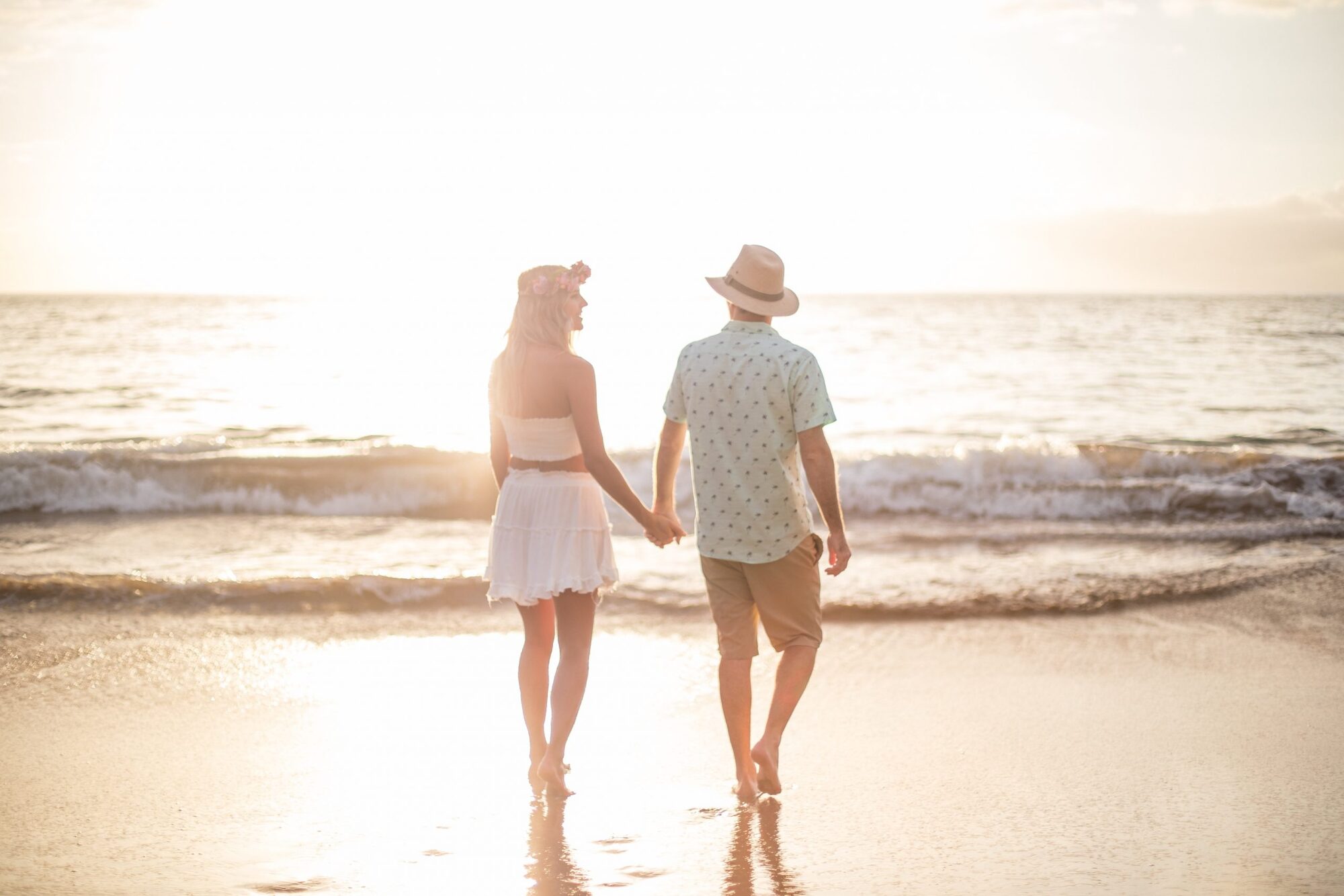 Jessie Hawaii Photography, Couple holding hands, walking on beach at sunset