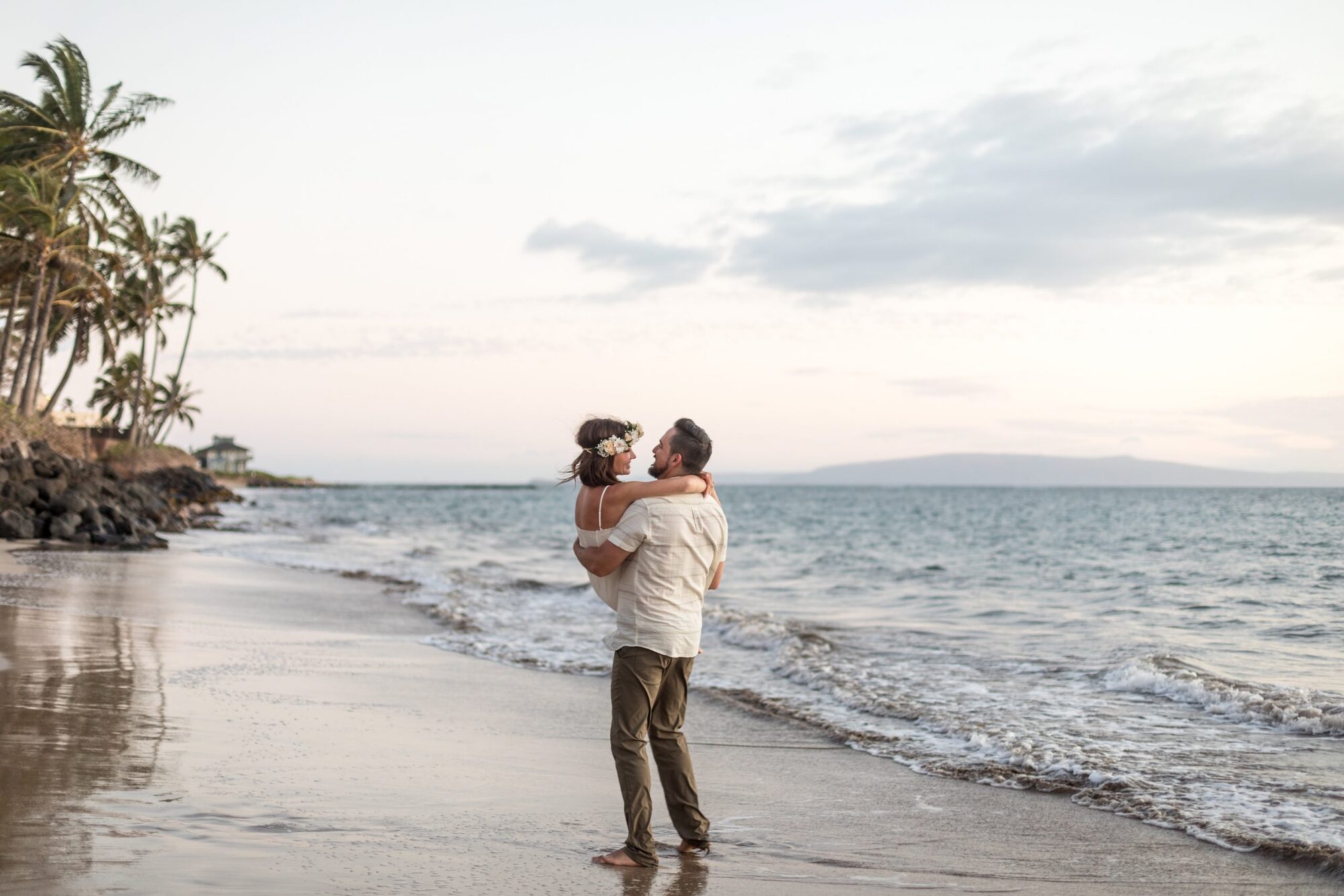 Jessie Hawaii Photography, Couple embracing on a beach at sunset