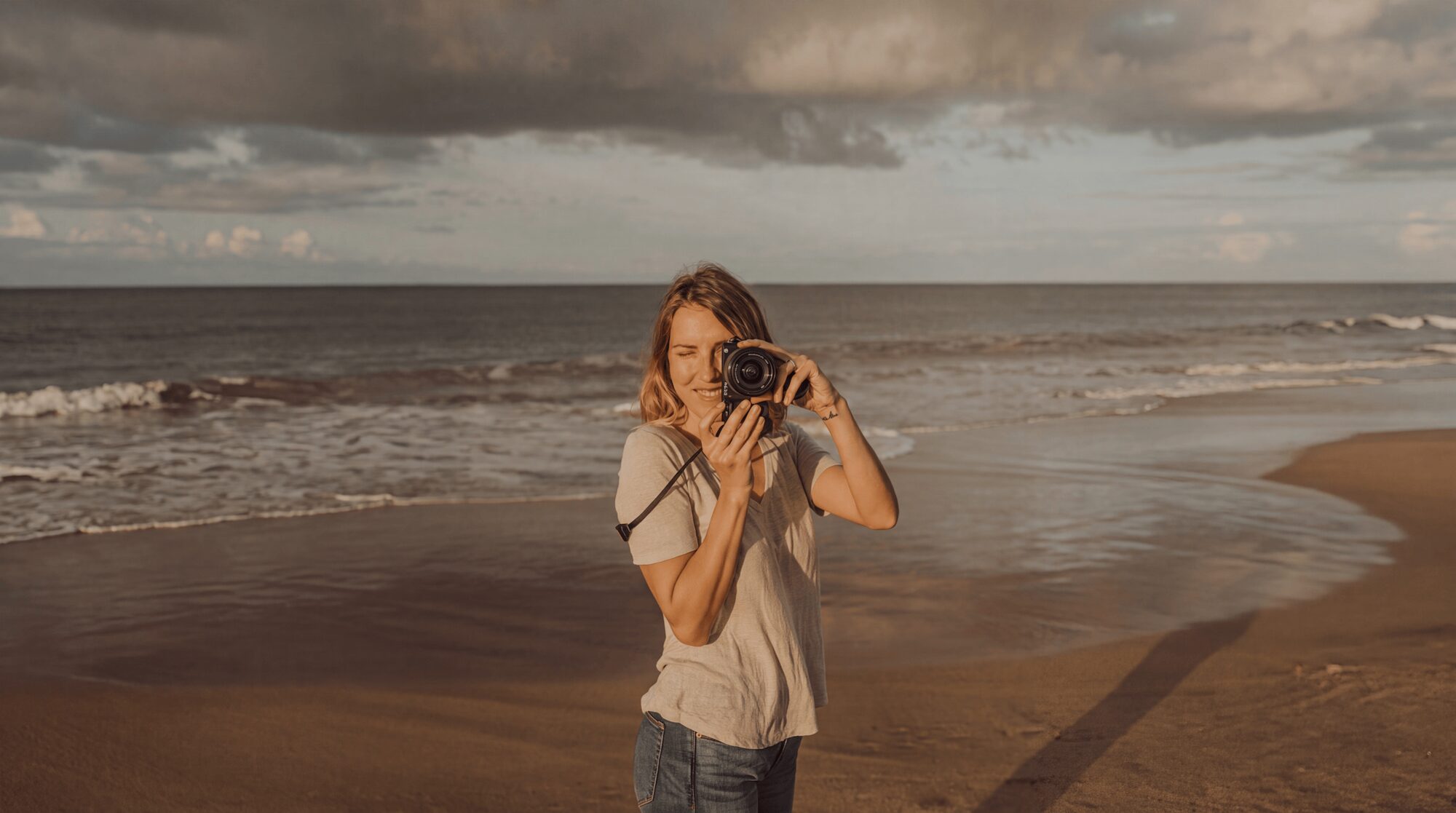 Jessie, the Maui photographer behind Jessie Hawaii Photography, shooting on the beach at golden hour