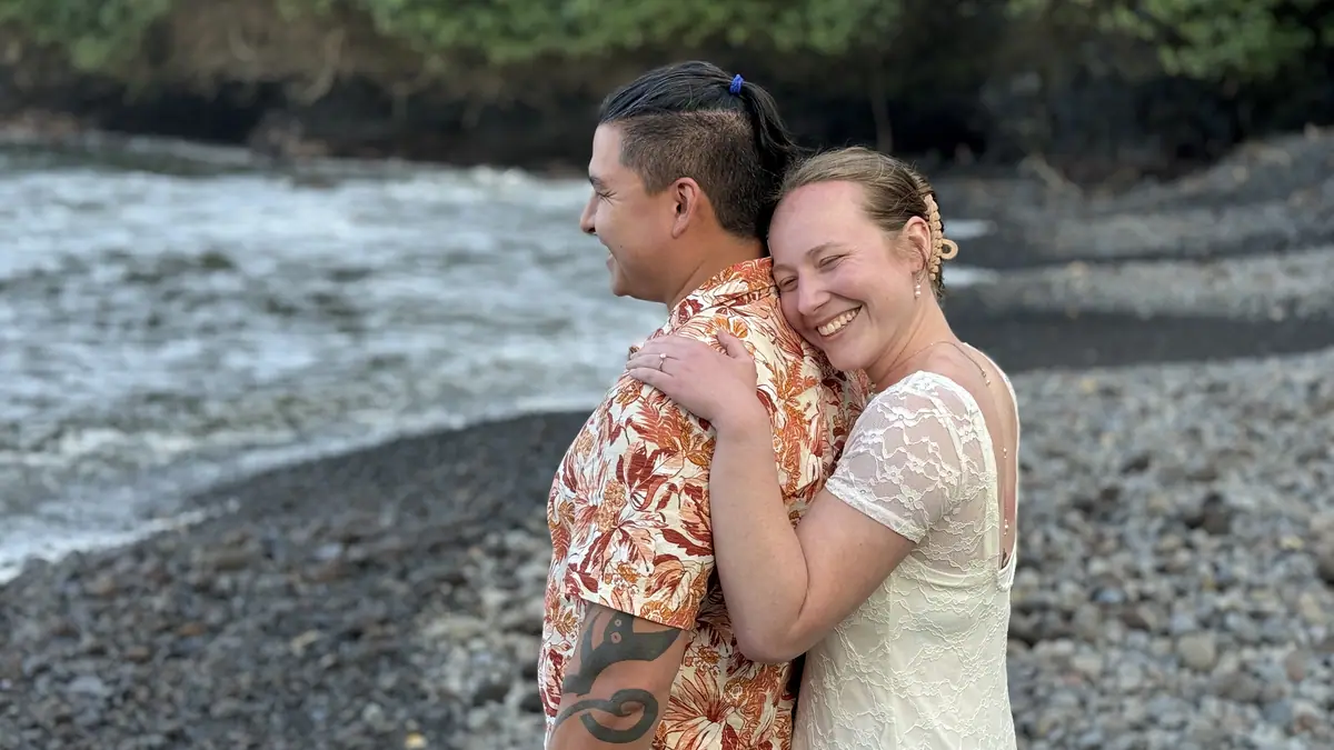 A couple at the mouth of a river on the Hana coast